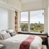 Bedroom with Resource Furniture Ulisse Desk Wall Bed, Cali Bamboo flooring, Yu-Yu jute rug, Plumen 003 Dimmable LED Pendanet Set, Modern Fan Cirrus Flush fan, Andersen 100 series windows, organic bedding by Boll & Branch, custom window seat with Oliver Yaphe pillows and ply cabinetry by Mike Gagne.